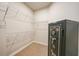 Walk-in closet with carpet, white wire shelving, and secure safe at 17921 Grand Prosperity Dr, Venice, FL 34293
