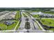 Aerial view of the TerraStone community entrance, showcasing the manicured landscaping and fountain at 17921 Grand Prosperity Dr, Venice, FL 34293