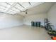 Spacious two car garage with epoxy flooring and ample storage for vehicles and other items at 17921 Grand Prosperity Dr, Venice, FL 34293