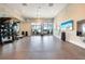 Bright gym with fitness equipment, weights, and a mounted television for a dynamic workout environment at 17921 Grand Prosperity Dr, Venice, FL 34293