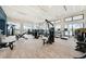 Well-equipped gym featuring modern exercise machines, natural light, and ample space for various workout activities at 17921 Grand Prosperity Dr, Venice, FL 34293