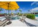 Inviting hot tub surrounded by comfortable lounge chairs and lush landscaping, perfect for relaxation at 17921 Grand Prosperity Dr, Venice, FL 34293
