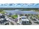 An attractive town center features lake access, parking, retail and an event lawn in a modern planned community at 17921 Grand Prosperity Dr, Venice, FL 34293