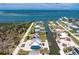 Aerial view of waterfront home with boat dock, canal access, and proximity to the Gulf at 1930 Massachusetts Ave, Englewood, FL 34224