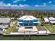 Waterfront home featuring a metal roof, private pool, and dock access to the Gulf of Mexico at 1930 Massachusetts Ave, Englewood, FL 34224