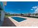 Exterior view of the pool, waterfront canal, dock, and surrounding landscaping at 1930 Massachusetts Ave, Englewood, FL 34224