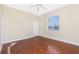 Bright bedroom with concrete floors, a ceiling fan, and a window with blinds at 1930 Massachusetts Ave, Englewood, FL 34224