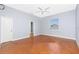 Serene bedroom with light walls, ceiling fan and natural light at 1930 Massachusetts Ave, Englewood, FL 34224