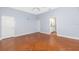 Spacious bedroom with neutral walls and doorway view to the bathroom at 1930 Massachusetts Ave, Englewood, FL 34224