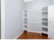 Walk-in closet with custom shelving for optimal organization at 1930 Massachusetts Ave, Englewood, FL 34224