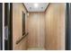 Interior view of a residential elevator with wood paneled walls at 1930 Massachusetts Ave, Englewood, FL 34224
