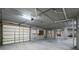Spacious garage with ample storage and an automatic door at 1930 Massachusetts Ave, Englewood, FL 34224