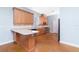 Bright kitchen with light wood cabinets, stainless steel appliances, and a spacious island at 1930 Massachusetts Ave, Englewood, FL 34224