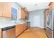 Modern kitchen with stainless steel appliances, wooden cabinets, and ample counter space at 1930 Massachusetts Ave, Englewood, FL 34224