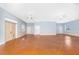 Open living area featuring stained concrete floors, high ceilings with ceiling fans, and lots of natural light at 1930 Massachusetts Ave, Englewood, FL 34224