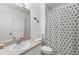 Bathroom features a toilet, shower with curtain, and vanity with sink and mirror at 19375 Water Oak Dr # 203, Port Charlotte, FL 33948