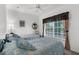 Comfortable bedroom featuring two twin beds with soft bedding and a large window at 19375 Water Oak Dr # 203, Port Charlotte, FL 33948