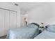 Well-lit bedroom with twin beds, closet space, and serene decor at 19375 Water Oak Dr # 203, Port Charlotte, FL 33948