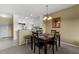 Bright dining area with a table set for four and a convenient pass-through to the kitchen at 19375 Water Oak Dr # 203, Port Charlotte, FL 33948