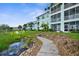 Enjoy easy access to community walkways from your back patio at 19375 Water Oak Dr # 203, Port Charlotte, FL 33948