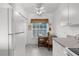 Cozy kitchen nook area with white cabinetry and natural light at 19375 Water Oak Dr # 203, Port Charlotte, FL 33948