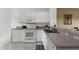 Functional kitchen with white cabinetry and appliances at 19375 Water Oak Dr # 203, Port Charlotte, FL 33948