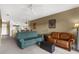 Open-concept living room with a ceiling fan and a view into the dining and kitchen areas at 19375 Water Oak Dr # 203, Port Charlotte, FL 33948