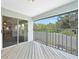 Inviting balcony with private outdoor view; access to the bonus room with a large sliding glass door at 196 Lecturn St, Port Charlotte, FL 33954