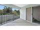 Cozy balcony with view of mature trees and lush greenery; private access from sliding glass door at 196 Lecturn St, Port Charlotte, FL 33954