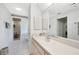 Clean bathroom with a glass door shower, a large mirror and tile flooring at 196 Lecturn St, Port Charlotte, FL 33954