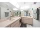 Bright bathroom features dual sinks, ample counter space, and a well-lit vanity area at 196 Lecturn St, Port Charlotte, FL 33954
