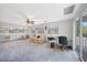 Spacious bonus room with natural light, ceiling fan, and access to an outdoor balcony at 196 Lecturn St, Port Charlotte, FL 33954
