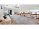 Large bonus room with railings overlooking the floor below, seating area, and bright natural light at 196 Lecturn St, Port Charlotte, FL 33954