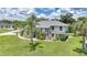 Two-story home with lush landscaping and large, well-manicured lawn at 196 Lecturn St, Port Charlotte, FL 33954