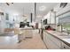 Kitchen featuring white cabinets, island, and view to the living area at 196 Lecturn St, Port Charlotte, FL 33954