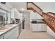 Clean kitchen featuring white cabinets, grey countertops, and stainless steel appliances at 196 Lecturn St, Port Charlotte, FL 33954