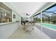 Outdoor patio with a dining table and a stunning view of the pool and backyard at 196 Lecturn St, Port Charlotte, FL 33954