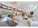 This living room boasts a loft, high ceilings, an open concept and direct access to the outdoor screened in pool at 196 Lecturn St, Port Charlotte, FL 33954