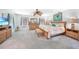 Spacious main bedroom with a ceiling fan, wooden furniture, and comfortable carpeting at 196 Lecturn St, Port Charlotte, FL 33954