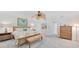 Cozy main bedroom featuring a ceiling fan, decorative artwork, and wooden furniture at 196 Lecturn St, Port Charlotte, FL 33954