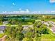 Beautiful aerial view of homes overlooking a lush green golf course and serene lake at 23 Pine Valley Ct, Rotonda West, FL 33947