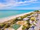 Aerial photo captures a beachfront area with a basketball court, boardwalk, and parking at 23 Pine Valley Ct, Rotonda West, FL 33947