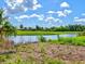 Beautiful view of the lake offering stunning waterfront scenery and tranquil surroundings at 23 Pine Valley Ct, Rotonda West, FL 33947