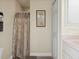 Small bathroom with shower and a large walk in closet at 23 Pine Valley Ct, Rotonda West, FL 33947