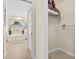 A doorway that leads to a bright bathroom with a soaking tub and natural light at 23 Pine Valley Ct, Rotonda West, FL 33947