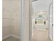 A doorway that leads to a bright bathroom with a soaking tub and natural light at 23 Pine Valley Ct, Rotonda West, FL 33947