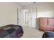 Bright bedroom featuring two twin beds, a dresser, and neutral carpeting at 23 Pine Valley Ct, Rotonda West, FL 33947