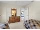 This bedroom offers two twin beds, dresser, and neutral carpeting at 23 Pine Valley Ct, Rotonda West, FL 33947