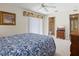 Cozy bedroom with a queen bed and en suite bathroom at 23 Pine Valley Ct, Rotonda West, FL 33947