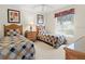 Well-lit bedroom featuring two twin beds, neutral carpeting and natural light at 23 Pine Valley Ct, Rotonda West, FL 33947